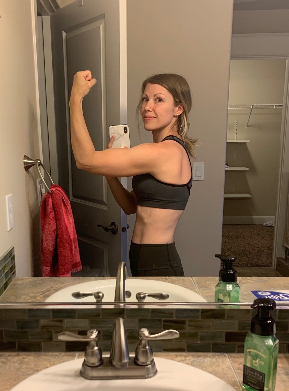 girl flexing in mirror