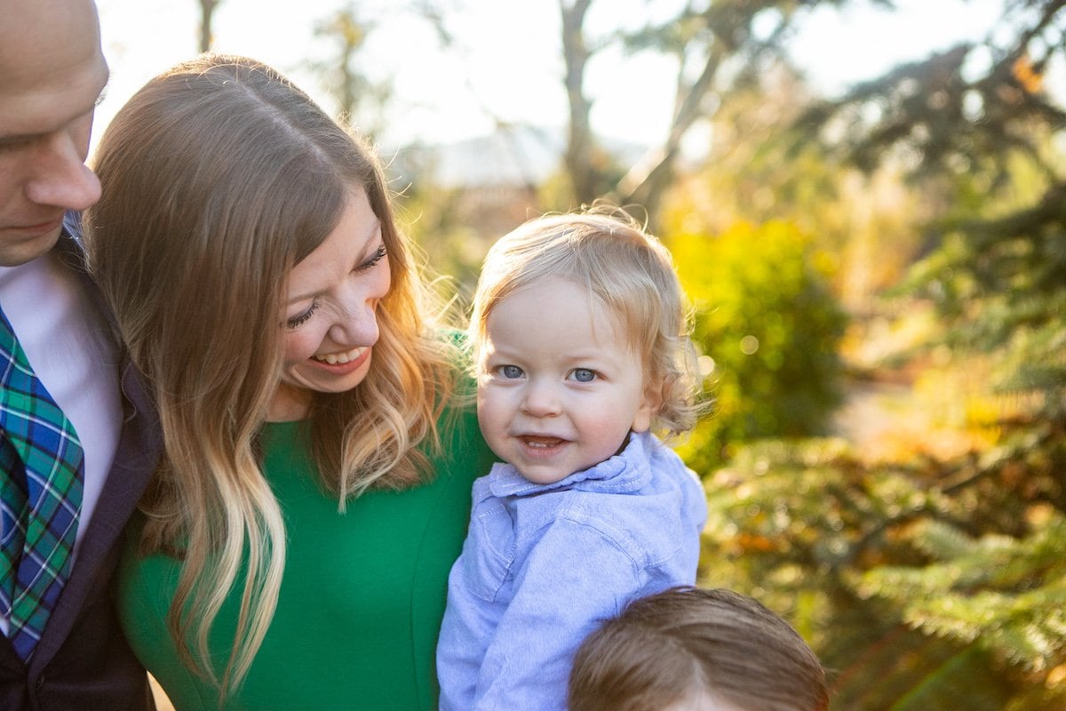 mother holding toddler