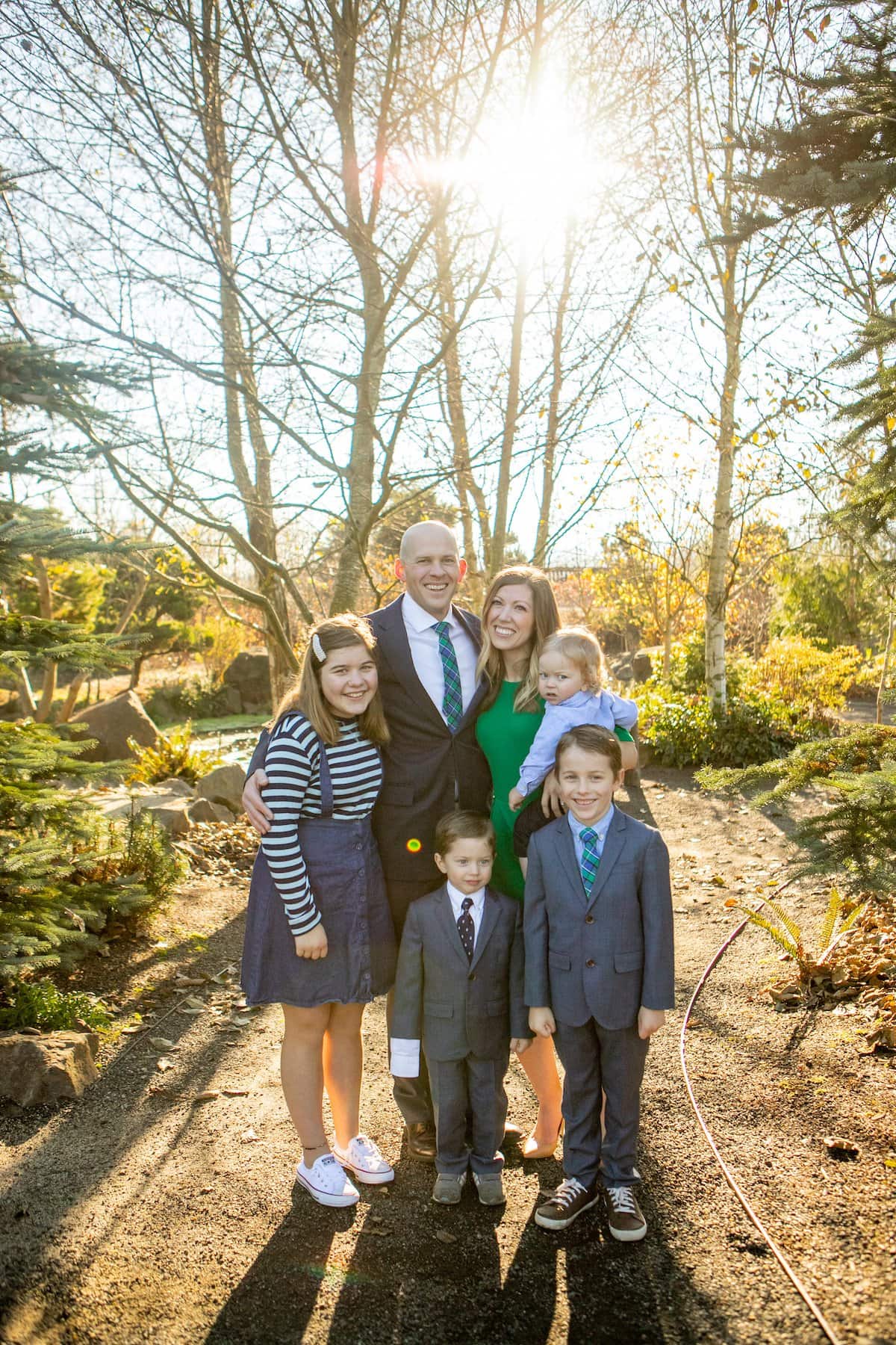 family smiling in forest