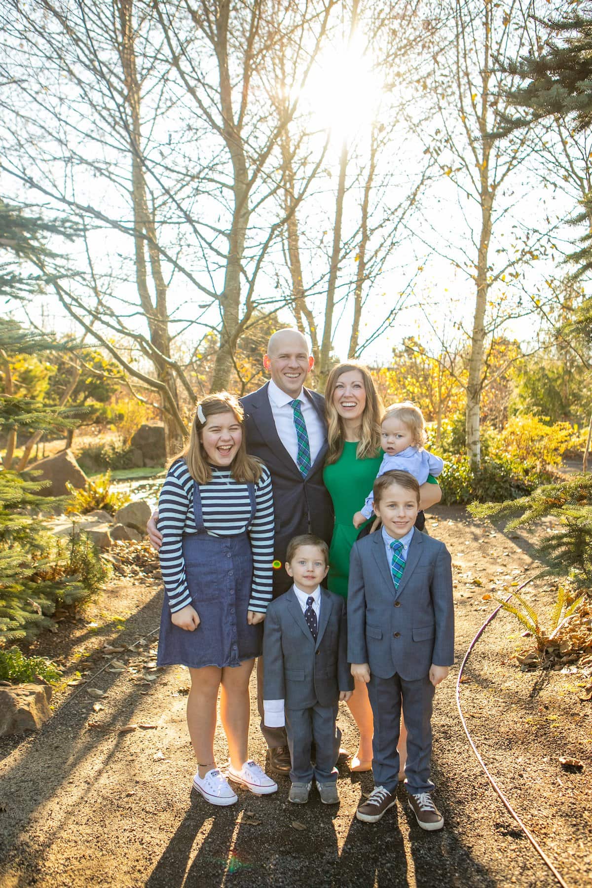family smiling in forest