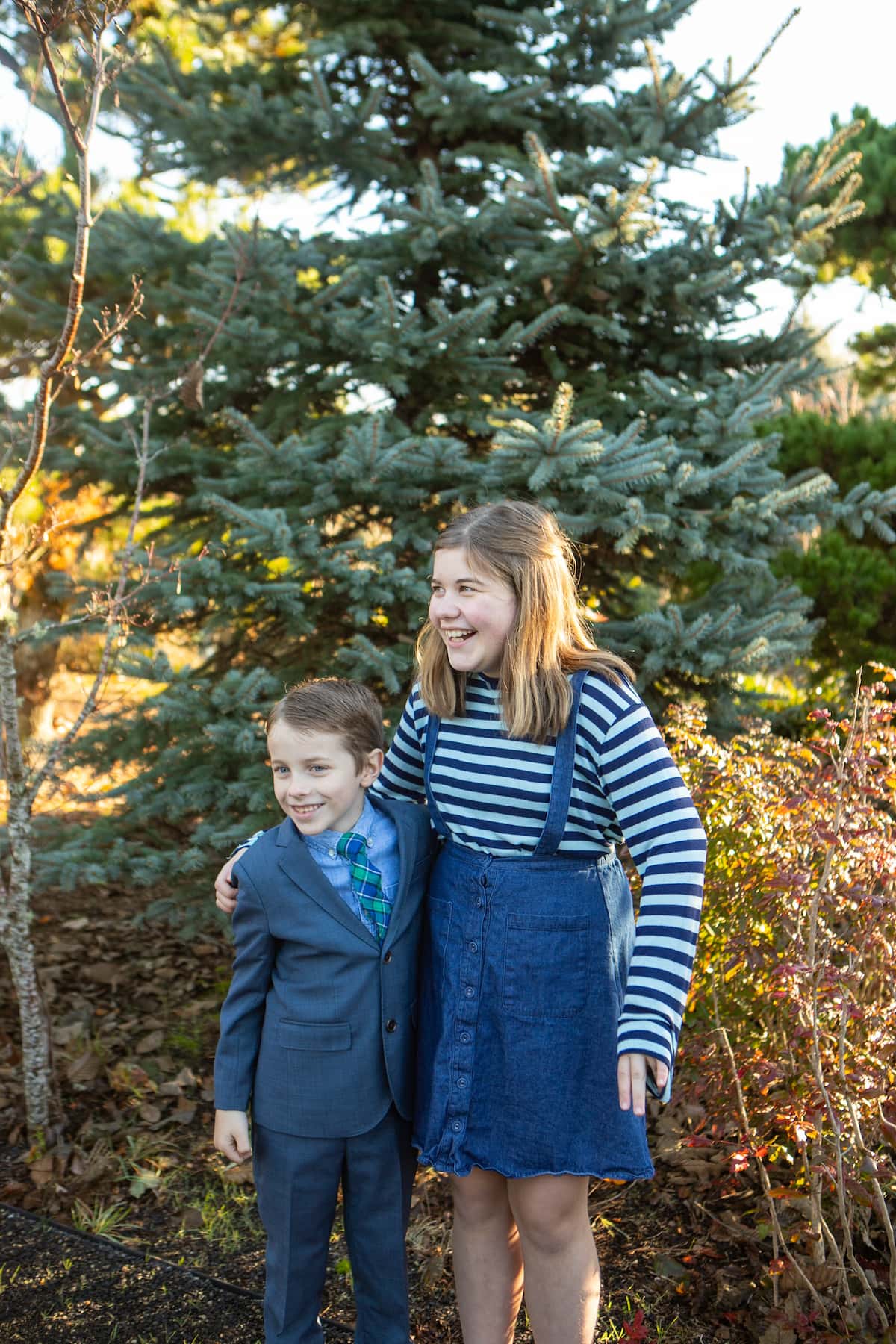 brother and sister laughing