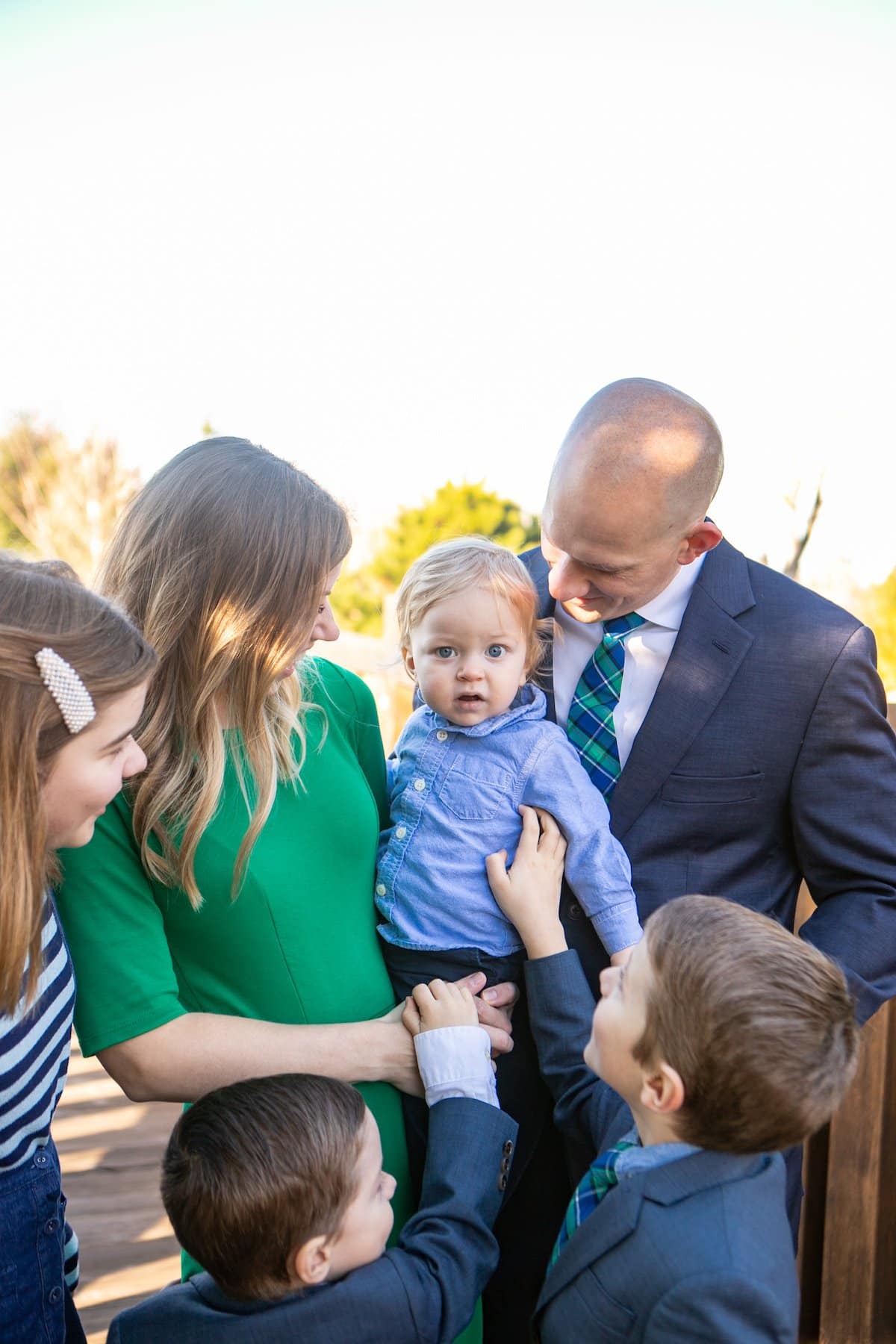 family looking at baby
