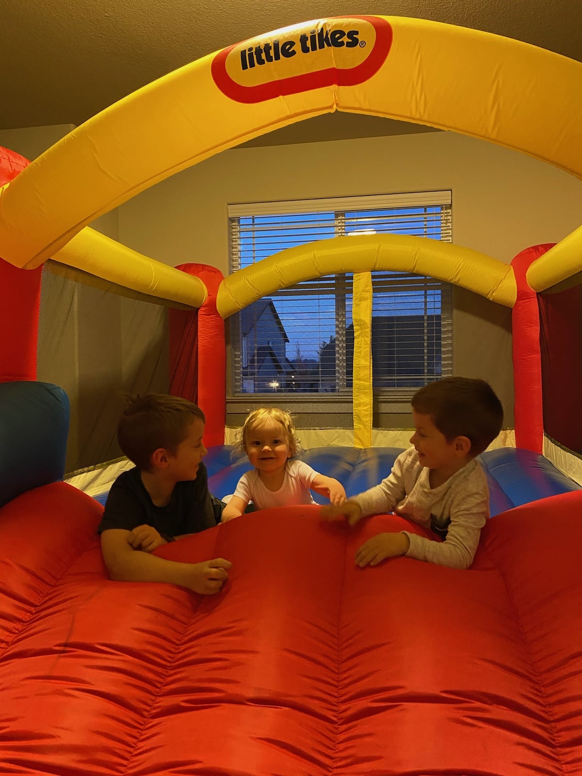 three boys in bounce house