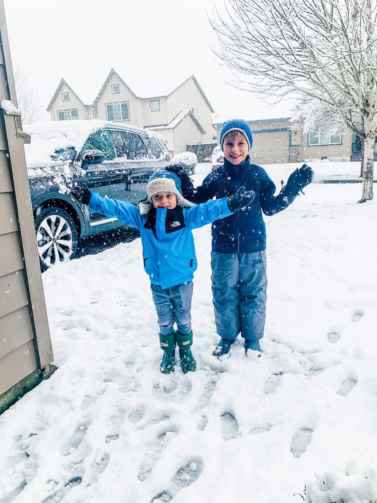 two boys outside in the snow