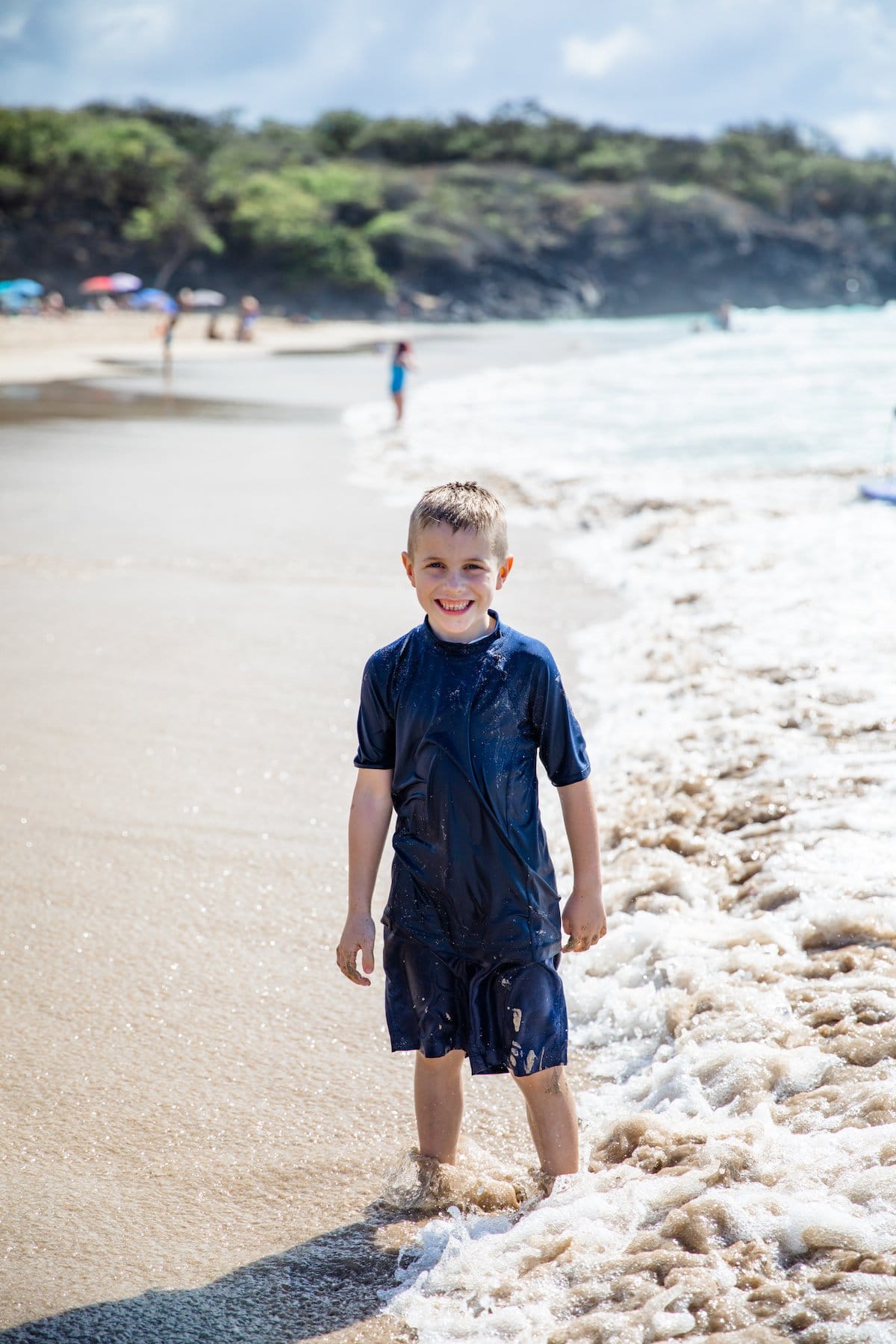 boy smiling on beach