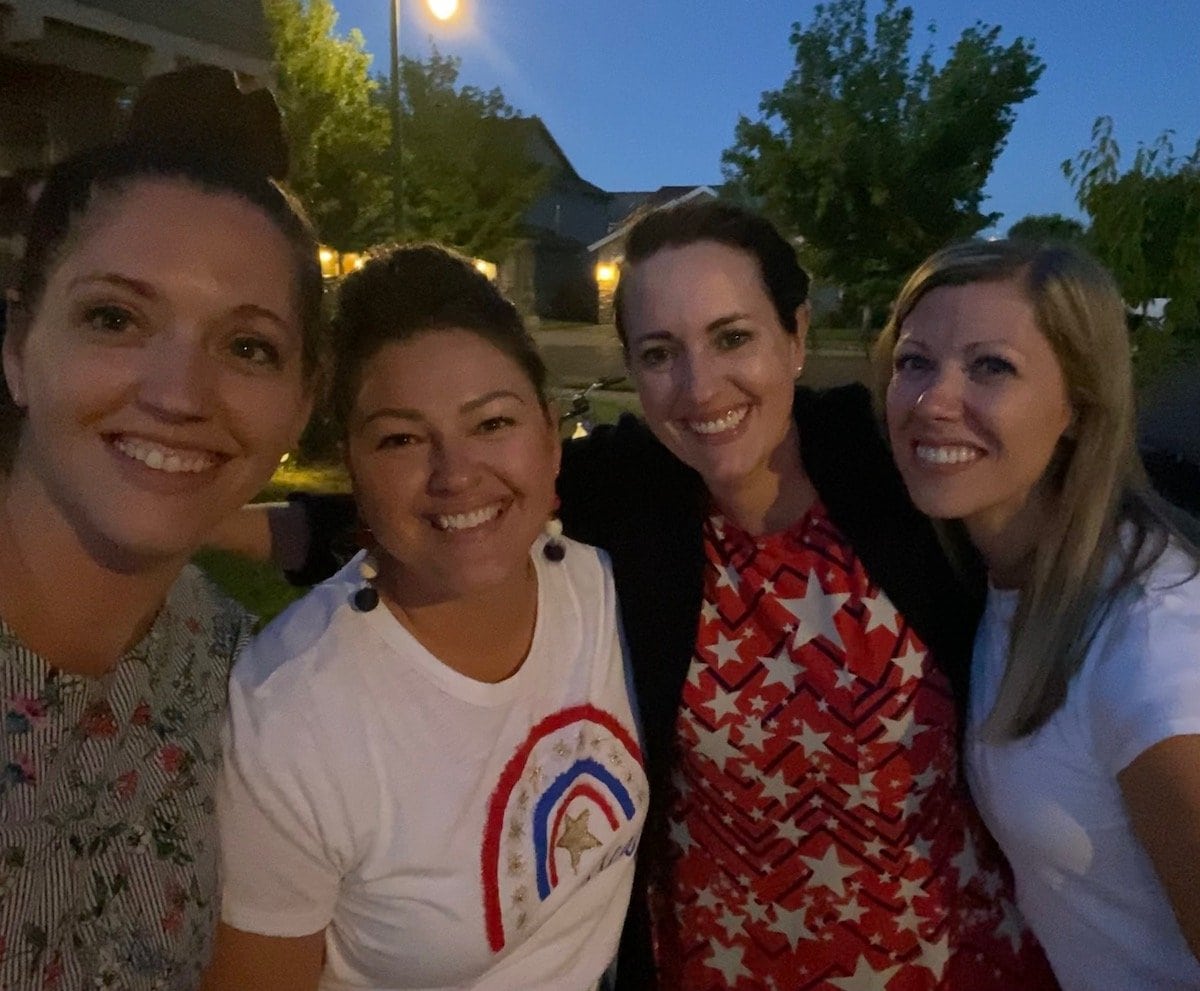 four friends smiling