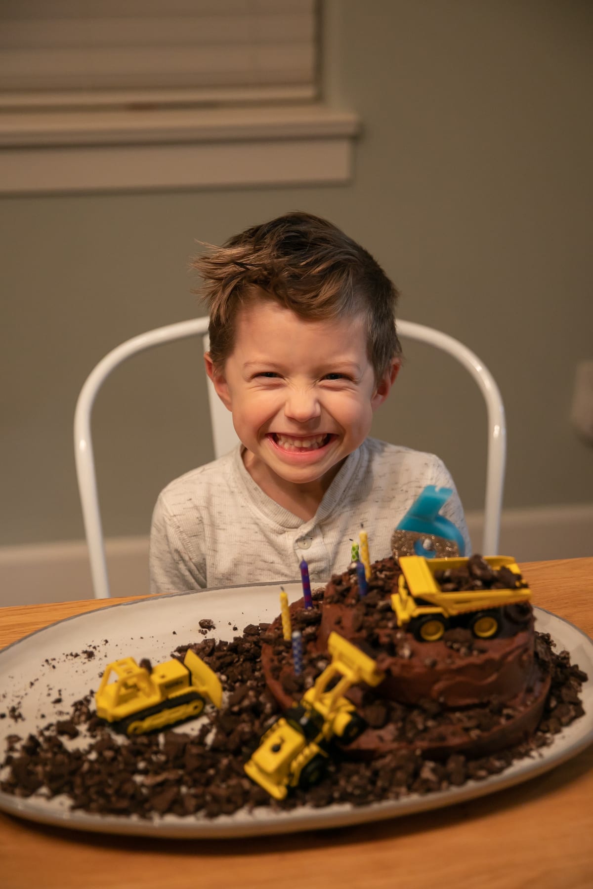boy smiling with cake