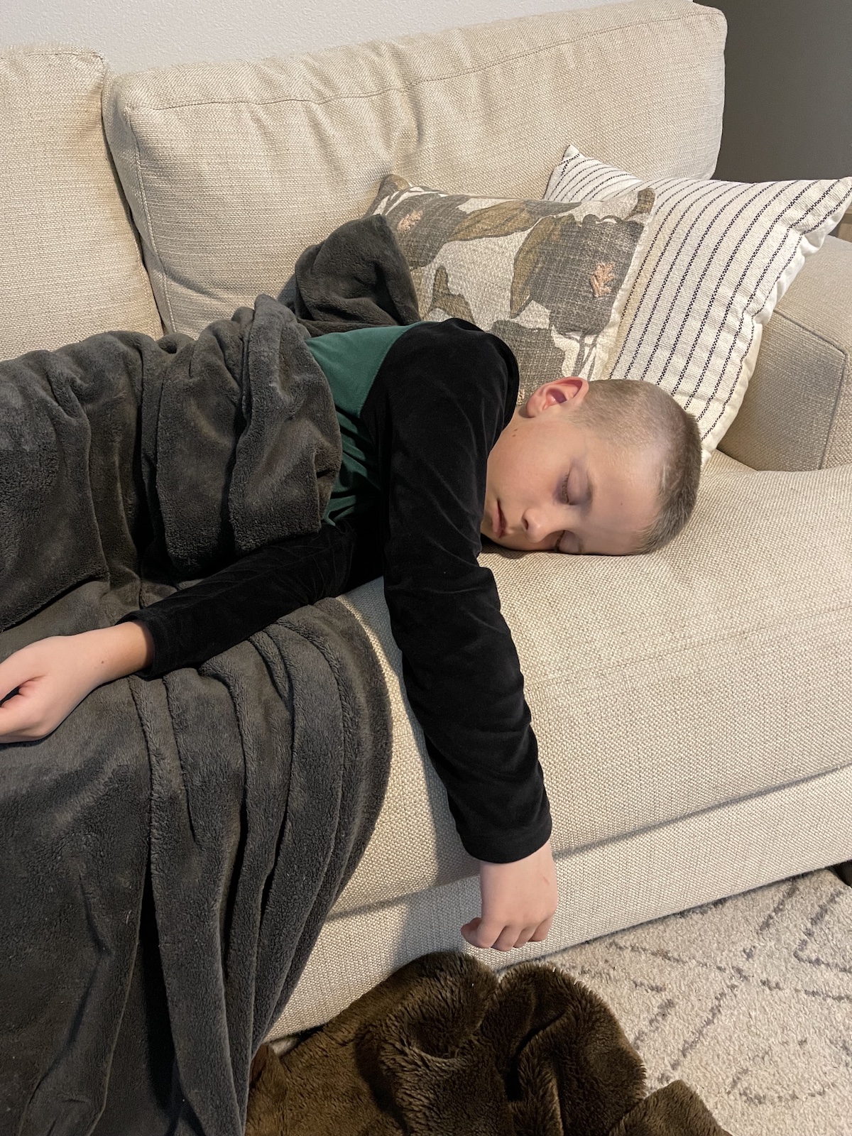 boy sleeping on couch