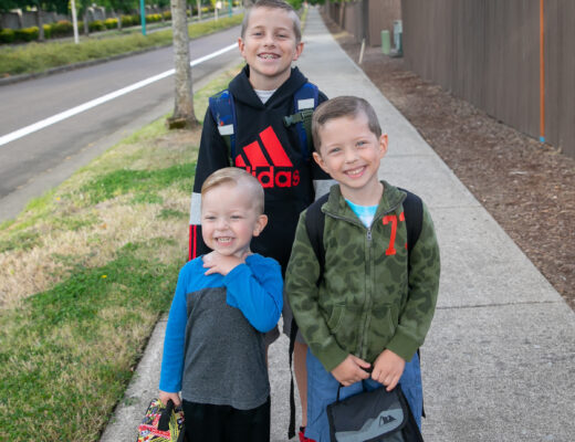 three brothers at bus stop