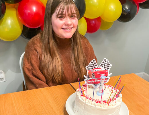 girl smiling with birthday cake